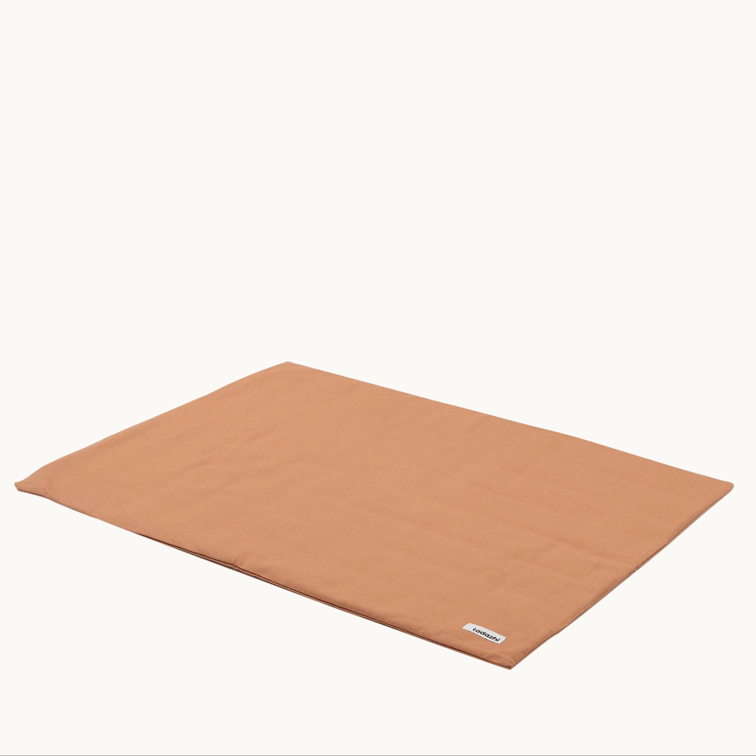 Minimalist Tadazhi duvet pet blanket in light brown organic cotton, washable and durable design from Lumi Pets Sleep collection.