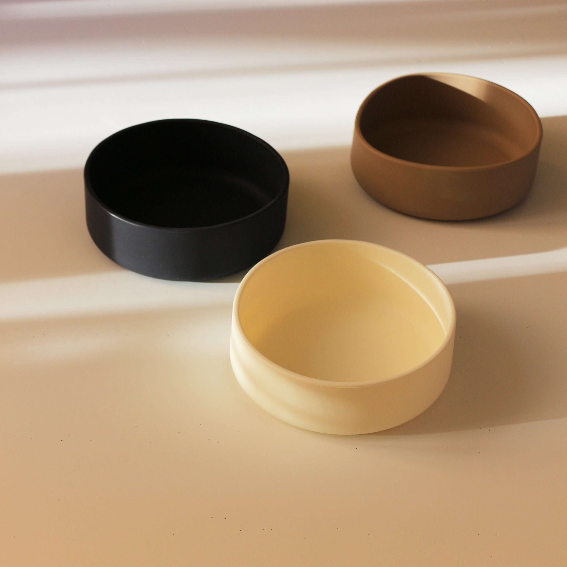 Side angle of Tadazhi minimalist silicone pet food bowl in 3 colours, sleek and durable design.