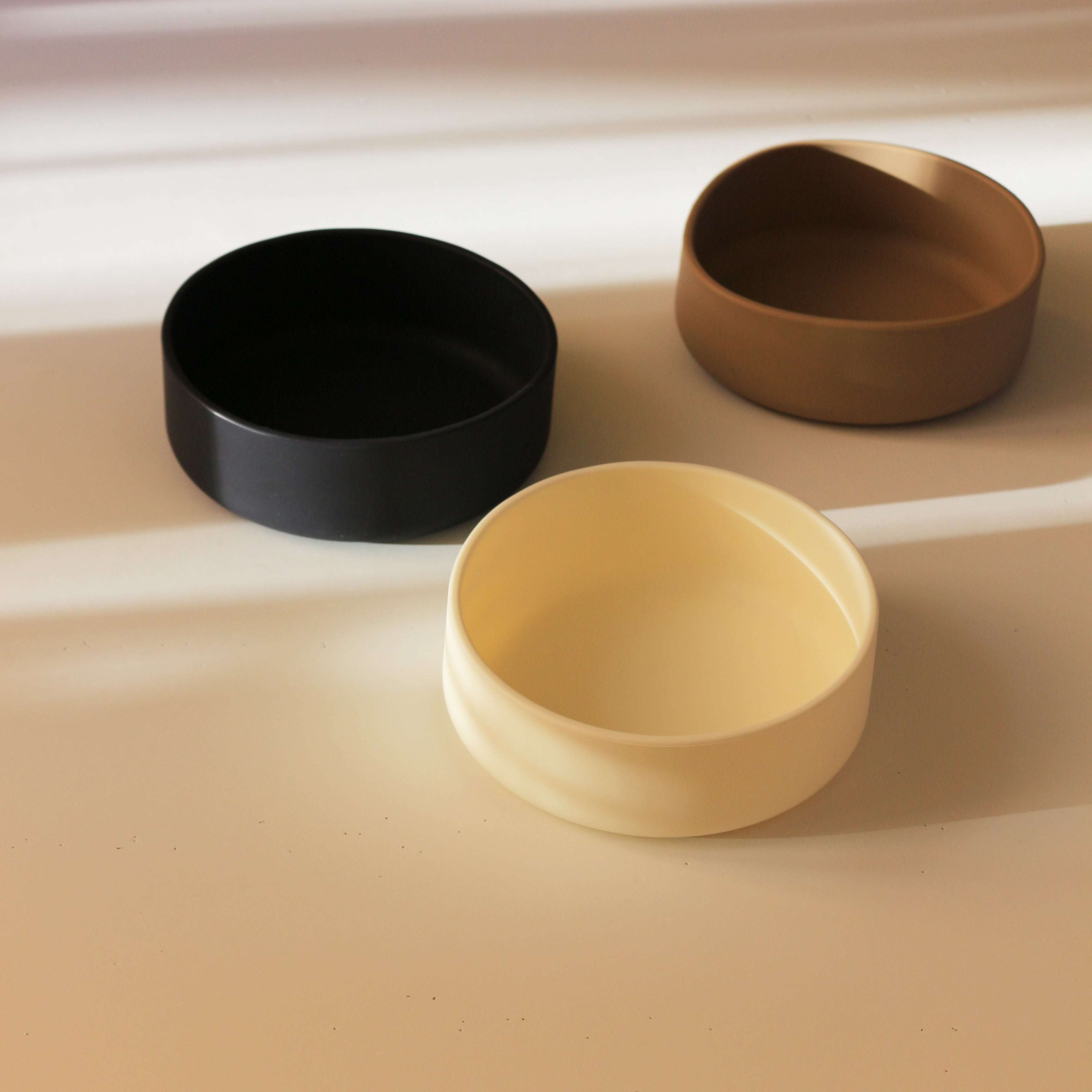 Side angle of Tadazhi minimalist silicone pet food bowl in 3 colours, sleek and durable design.