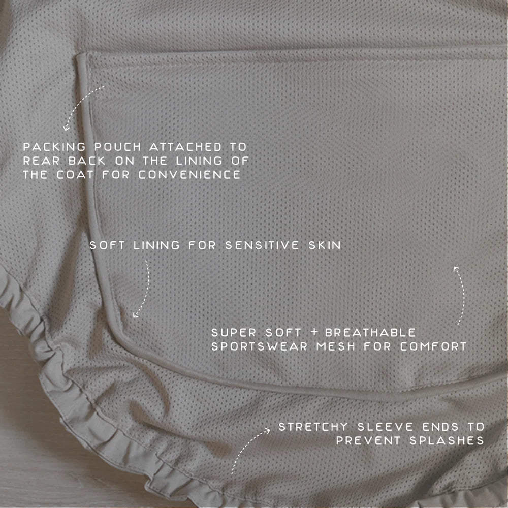 Close-up of Lambwolf Collective dog raincoats showing hood detail and adjustable drawstrings, modern minimalist style