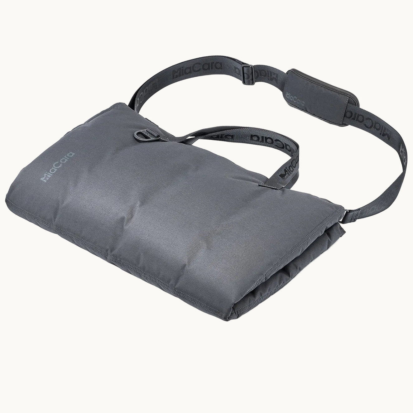 MiaCara Strada travel bed neatly rolled and secured with strap, compact and portable design for dogs on the go