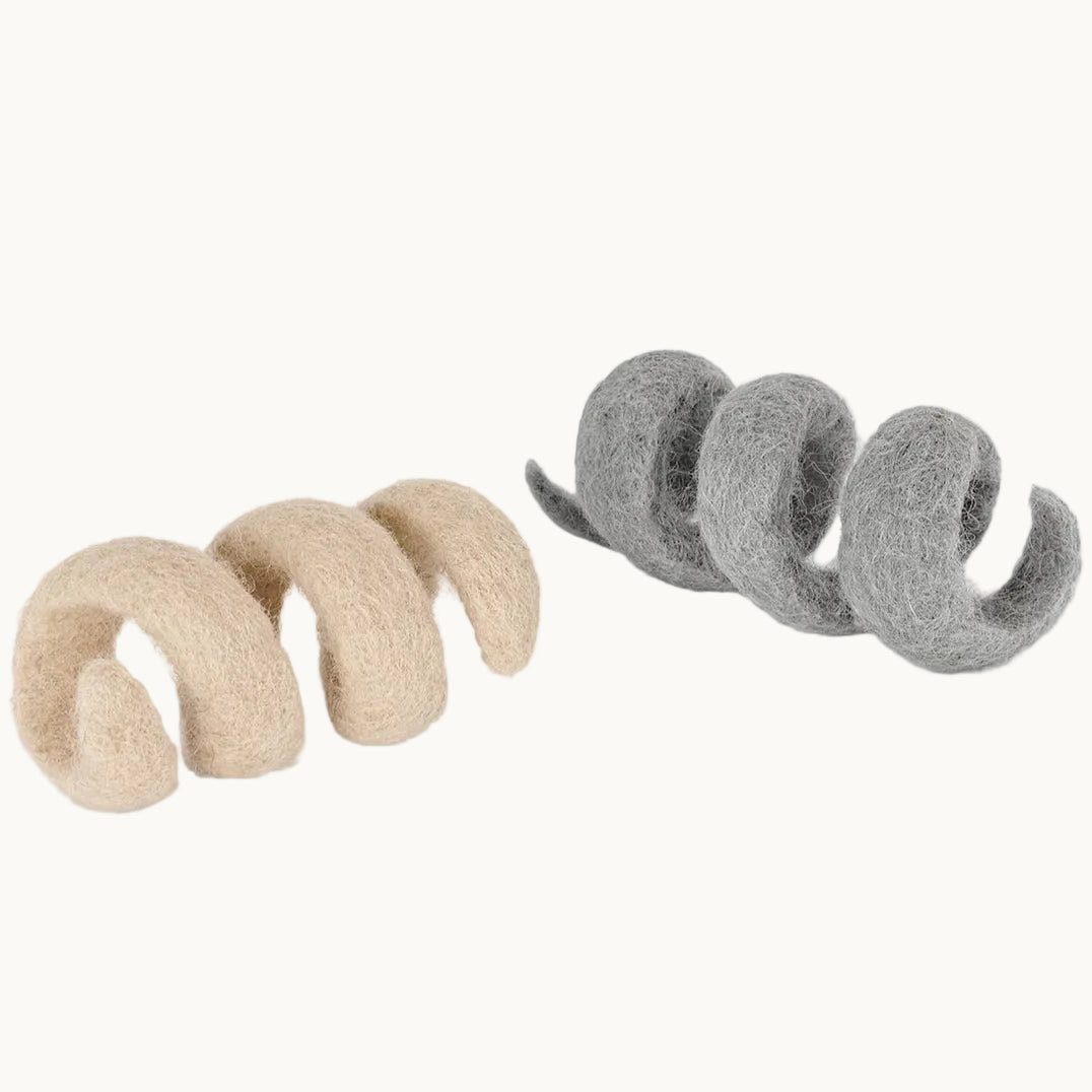 MiaCara Spira cat toy spirals made from natural wool felt in beige and grey, eco-friendly enrichment toy for cats.