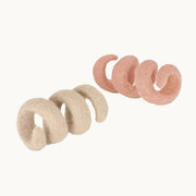 Set of MiaCara Spira cat toy spirals in beige and oink felt, crafted from 100% natural wool.