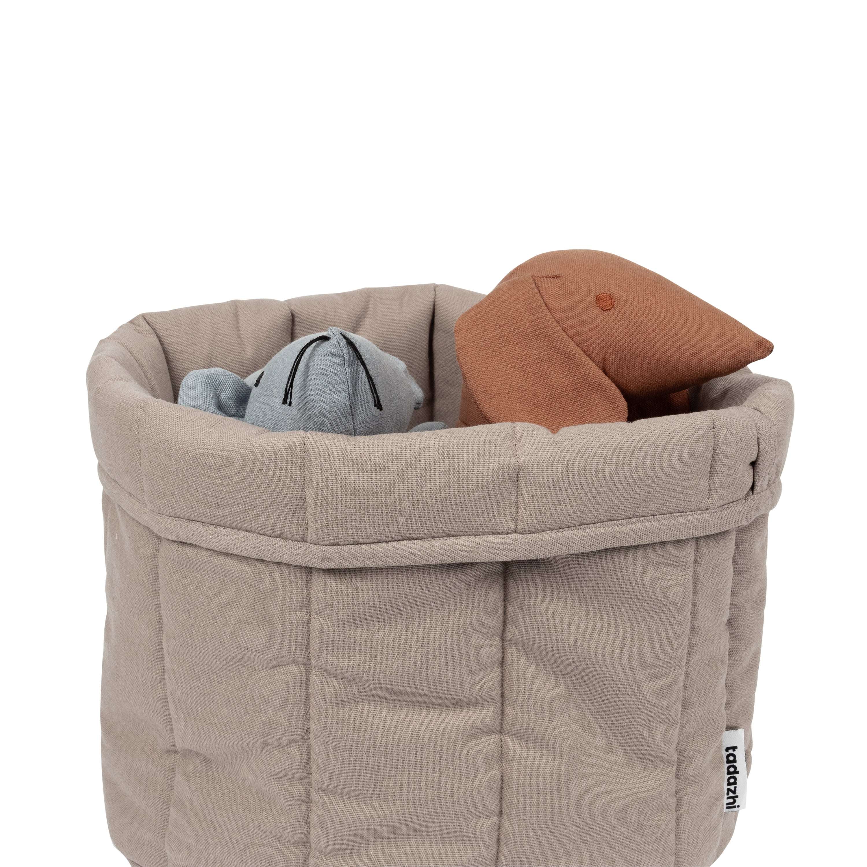Scandanavian style pet storage basket filled with toys from 