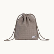 Minimalist dog treat bag in chequered dark sand fabric with drawstring closure, part of Tadazhi x Lumi Pets Walk collection.