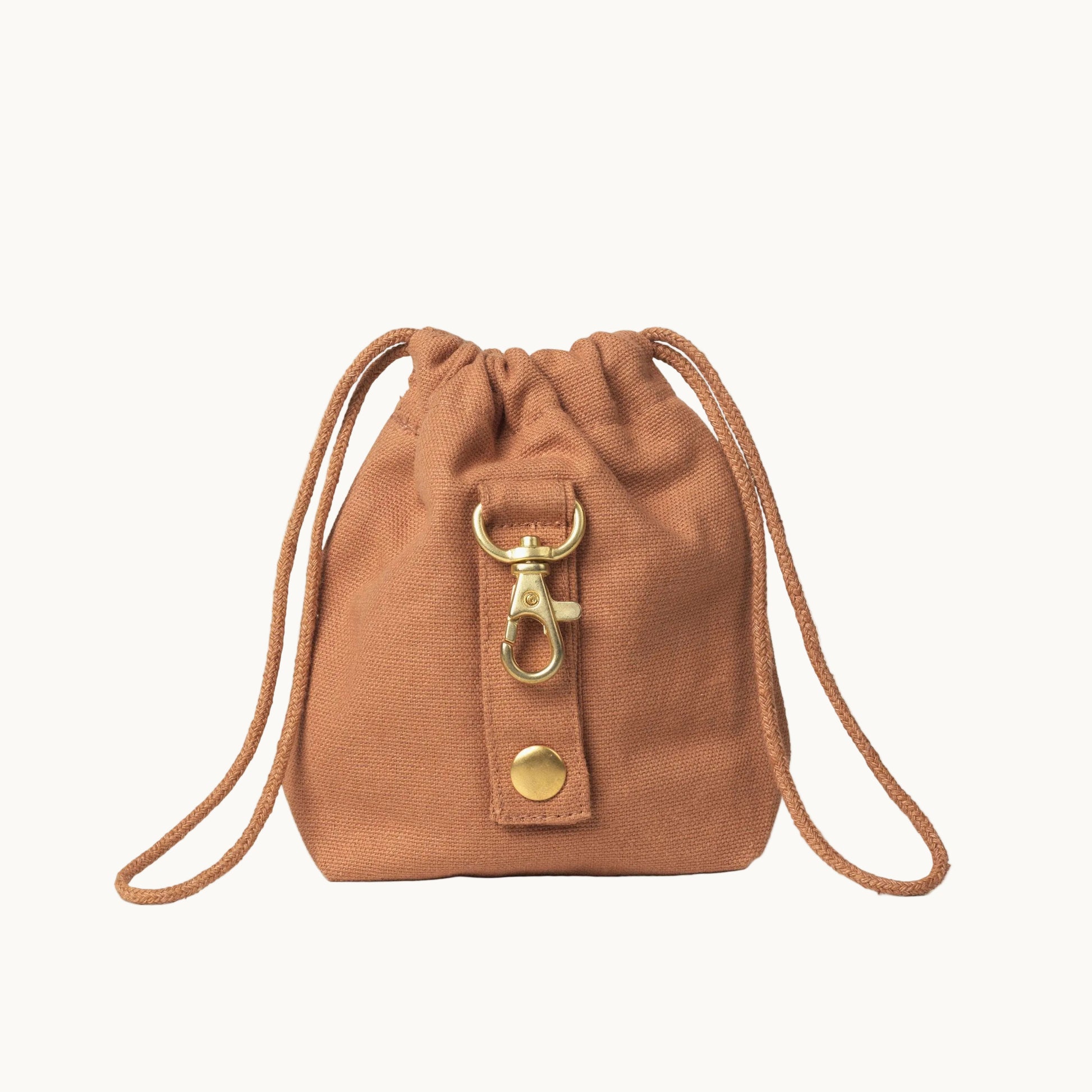 light brown dog treat bag by Tadazhi, back view showing gold buckle and sturdy drawstring straps