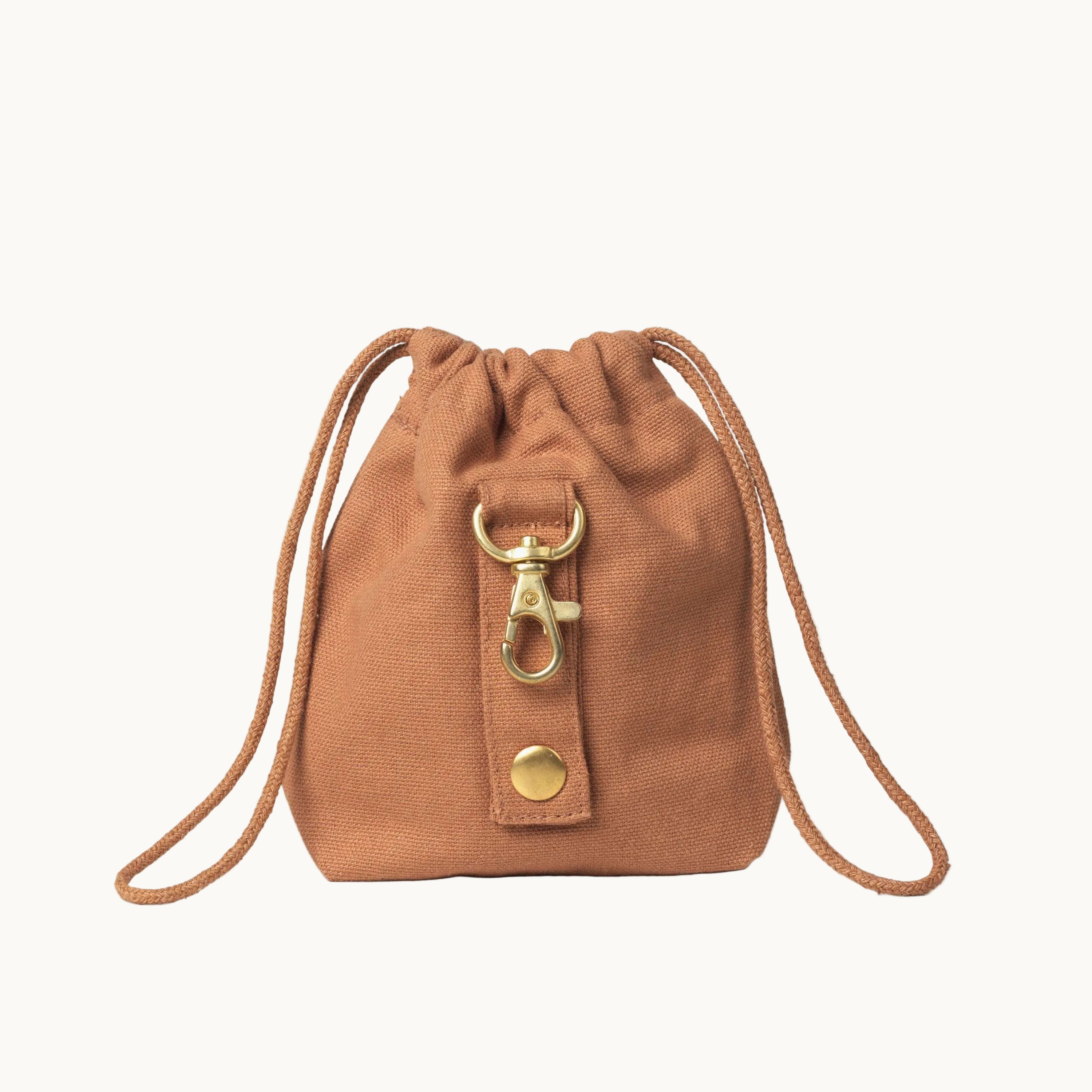 light brown dog treat bag by Tadazhi, back view showing gold buckle and sturdy drawstring straps
