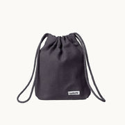 Minimalist dog treat bag in warm grey fabric with drawstring closure, part of Tadazhi x Lumi Pets Walk collection