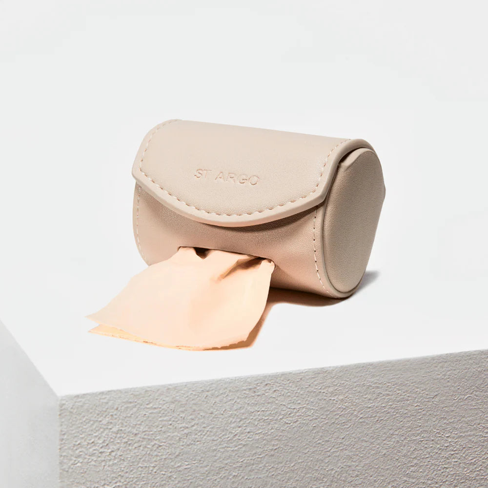 Minimalist beige vegan leather poop bag holder with stitched flap and embossed ST ARGO logo, functional accessory from Lumi Pets Walk collection