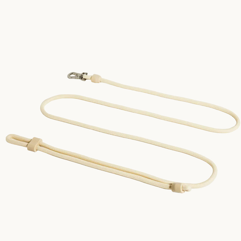 Cream-colored hands-free dog lead with 3-in-1 design, adjustable silicone slider and silver clasp, versatile leash from Lumi Pets Walk collection