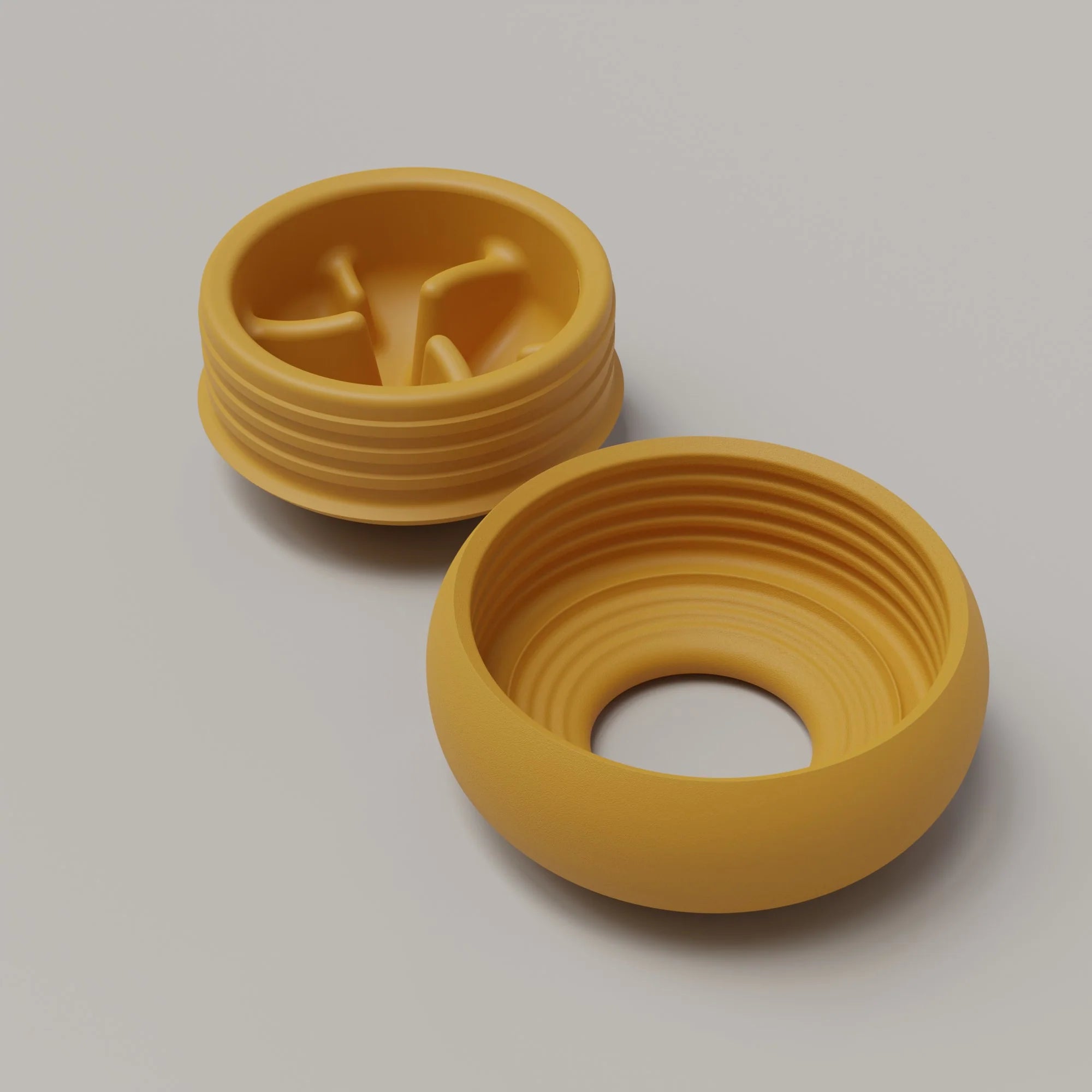 Lunoji Pebble interactive toy for dogs in yellow opened, minimalist round design that promotes enrichment and slow feeding