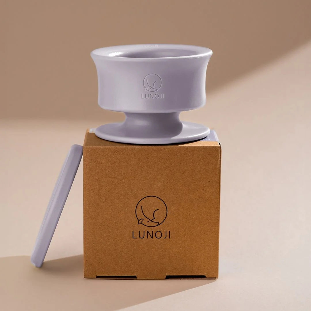 Lunoji Trove slow feeder in purple placed on branded kraft box, minimalist elevated design made from food-grade silicone for enrichment feeding