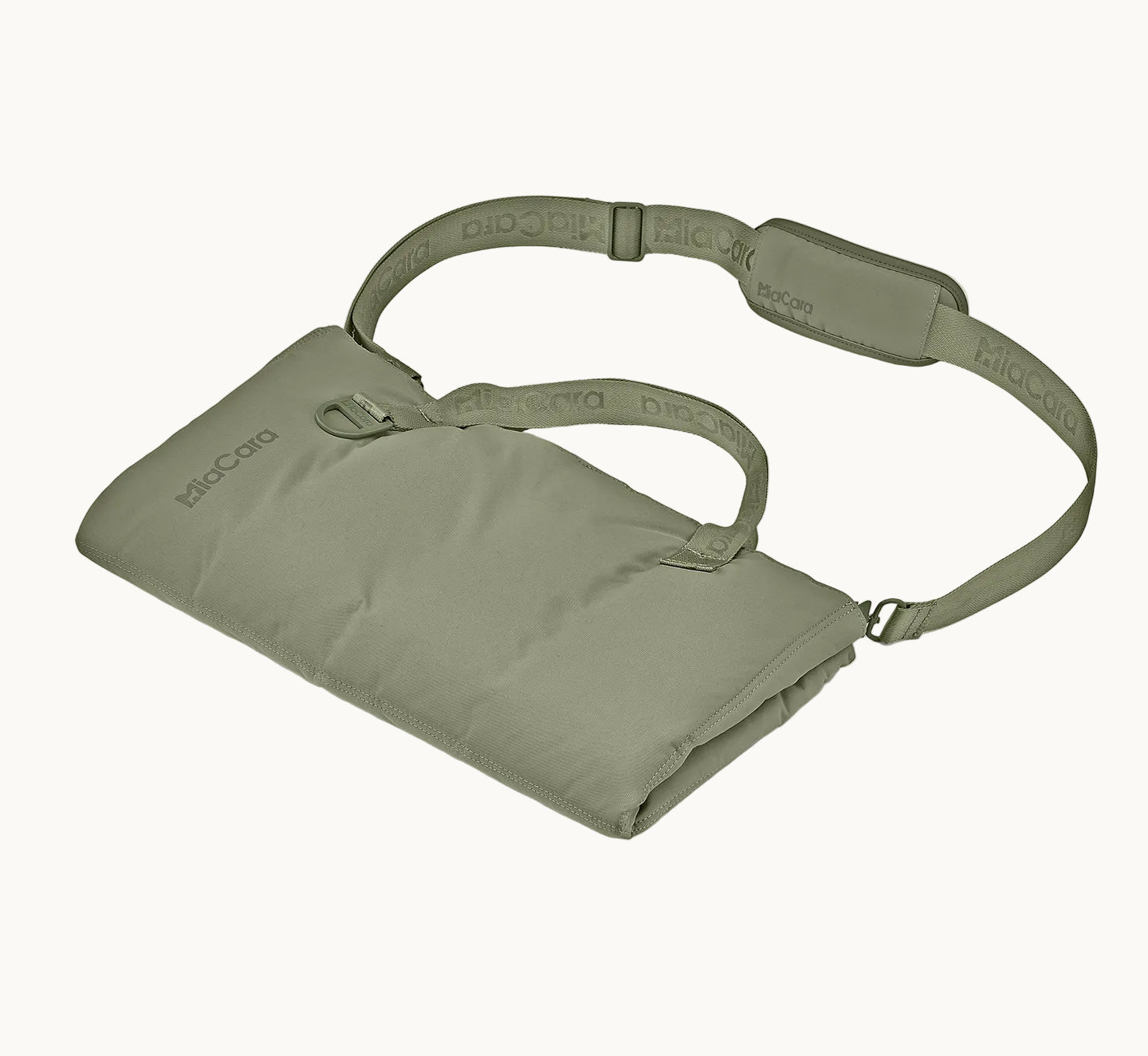MiaCara Strada travel bed in green neatly rolled and secured with strap, compact and portable design for dogs on the go