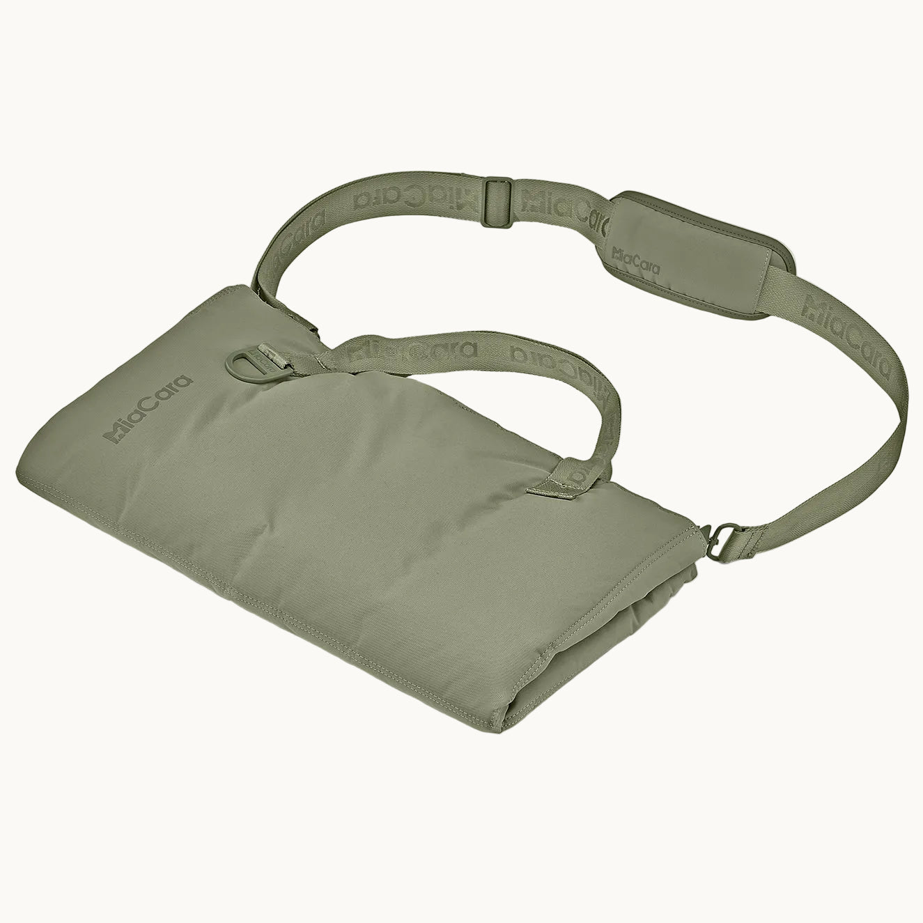 MiaCara Strada travel bed in green neatly rolled and secured with strap, compact and portable design for dogs on the go