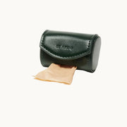 Minimalist green vegan leather poop bag holder with stitched flap and embossed ST ARGO logo, functional accessory from Lumi Pets Walk collection