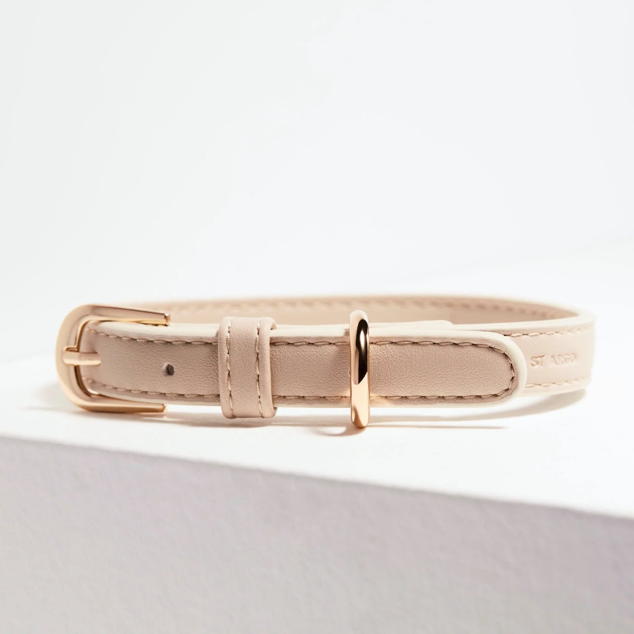 Minimalist beige vegan leather dog collar with gold buckle and ring, elegant and durable design from Lumi Pets Walk collection.