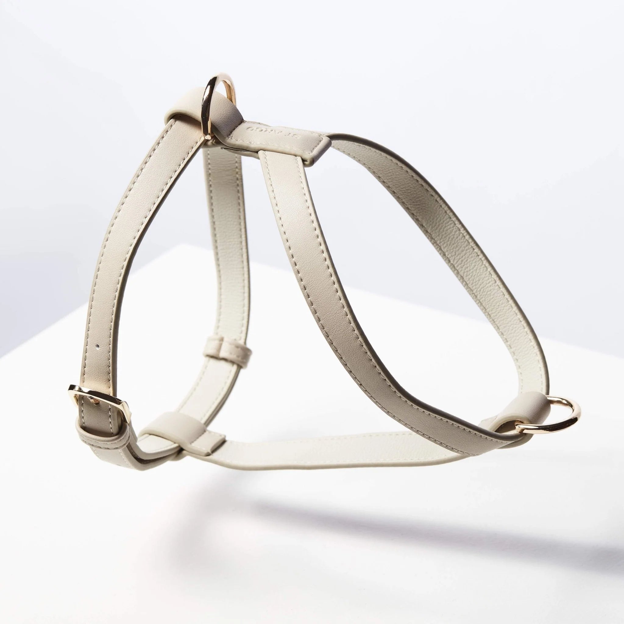 Minimalist beige vegan leather dog harness with gold hardware, durable and stylish design from Lumi Pets Walk collection